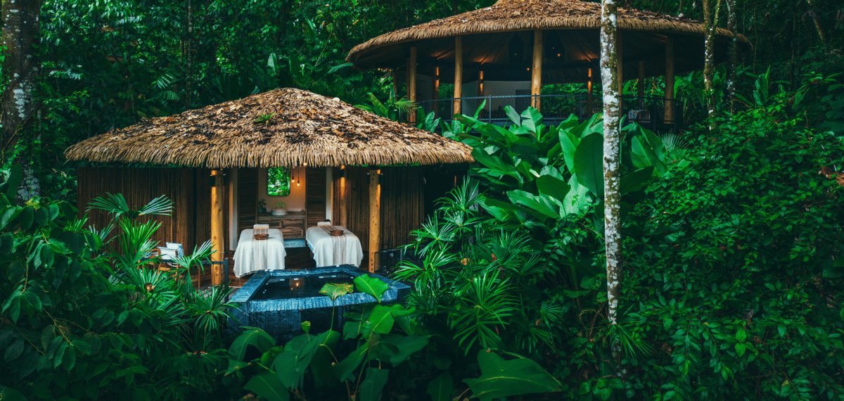 Open-air wellness pavilions surrounded by Costa Rican rainforest