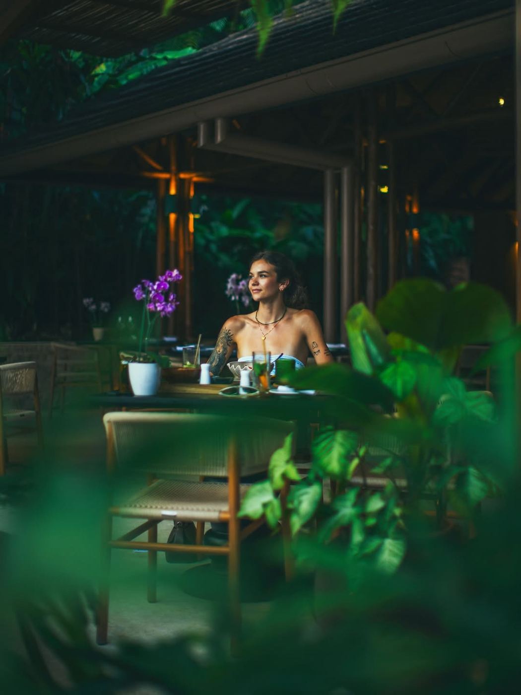 A guest using a laptop in the tropical surroundings of Nayara Gardens